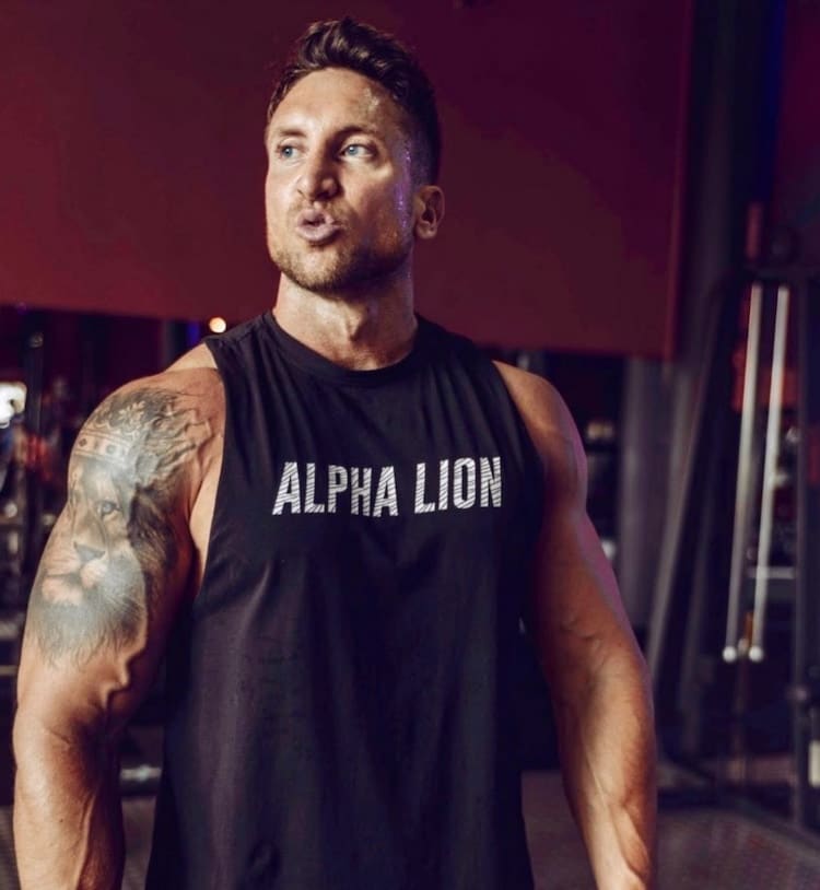 Troy Adashun Wearing Alpha Lion Shirt gym