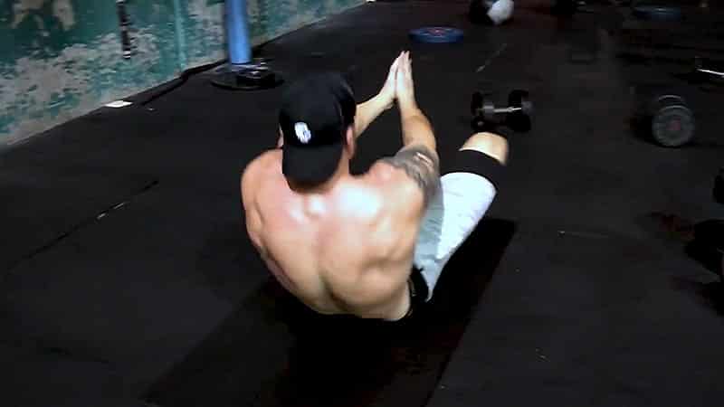 Troy doing butterfly crunches at the gym
