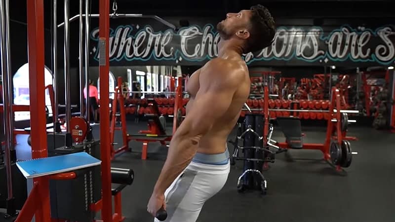 Troy in the starting position for the cable shrug exercise