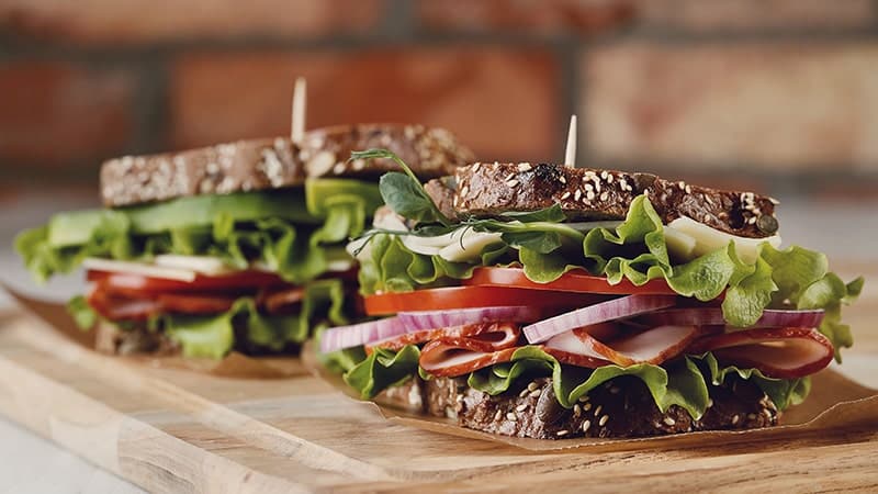 sandwiches on a wooden plate